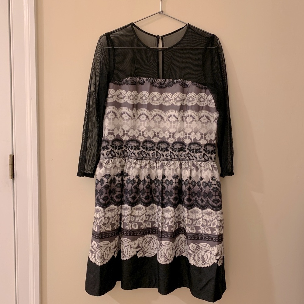 Formal dress with illusion neckline and sleeves.